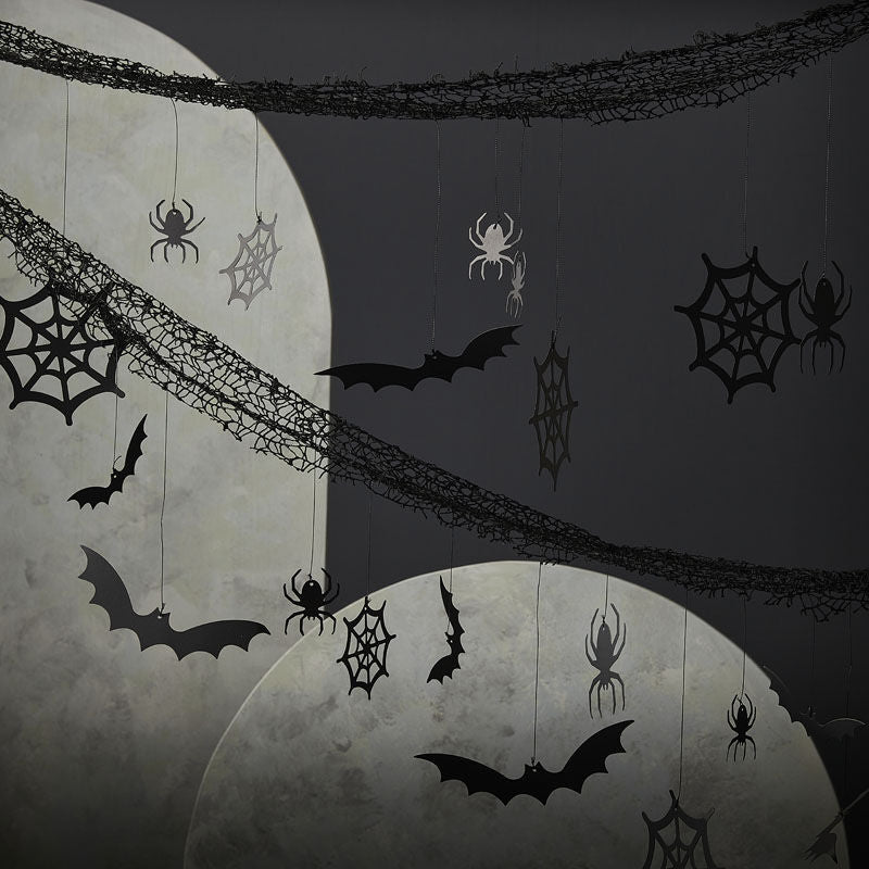 HALLOWEEN BACKDROP WITH HANGING SPIDERS, BATS AND COBWEBS